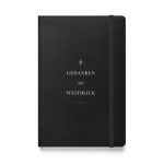 Schwarzes Hardcover-Notizbuch „Gedanken mit Weitblick“ mit elfenbeinfarbener Typografie und goldfarbenem Kompassornament, Vorderansicht.