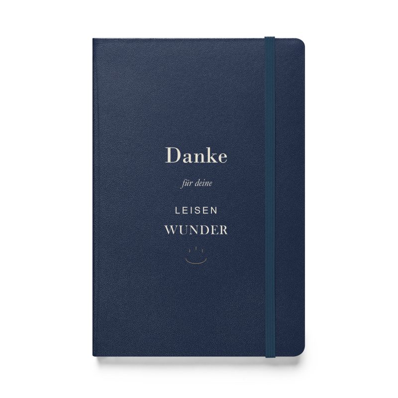 Marineblaues Hardcover-Notizbuch „Danke für deine leisen Wunder“ mit elfenbeinfarbener Typografie und kleinem goldfarbenem Ornament, Vorderansicht.
