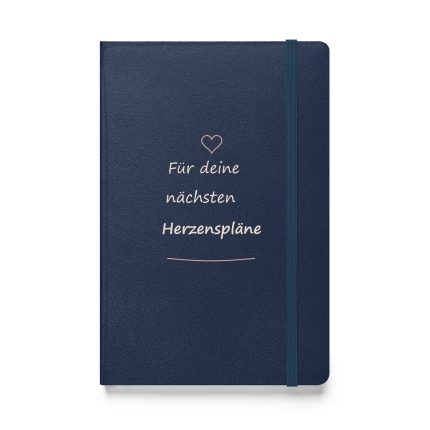 Marineblaues Hardcover-Notizbuch mit roséfarbenem Herz und cremefarbener Handschrift „Für deine nächsten Herzenspläne“