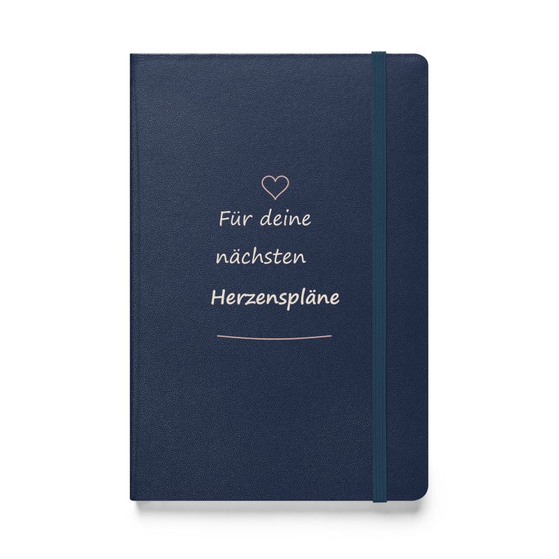 Marineblaues Hardcover-Notizbuch mit roséfarbenem Herz und cremefarbener Handschrift „Für deine nächsten Herzenspläne“