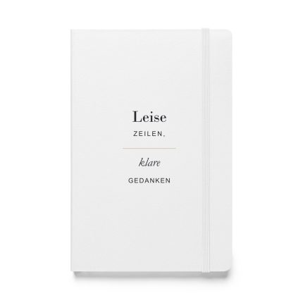 Weißes Hardcover-Notizbuch „Leise Zeilen, klare Gedanken“ mit dunkler Typografie und goldfarbener Linie, Vorderansicht.