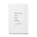 Weißes Hardcover-Notizbuch „Mein Atem findet freie Zeilen“ mit dunkelgrüner Serifenschrift und sanften Linien – Vorderansicht